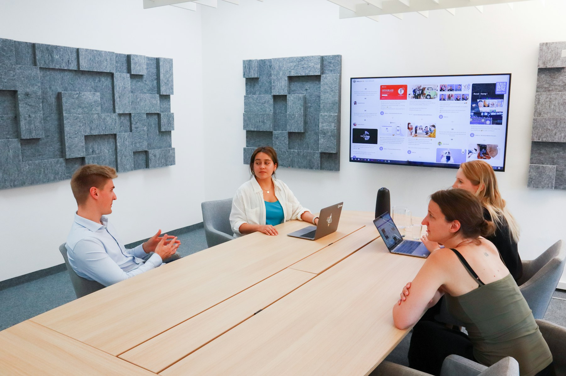 Professionals gathered around a work table